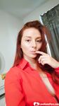 Naughty redhead reveals her big tits on cam