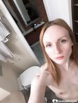 Skinny redhead girl posing in her bathroom naked